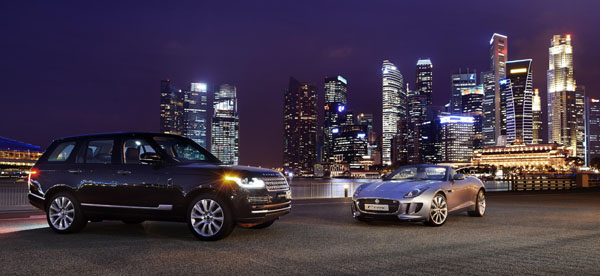 Jaguar F Type and Range Rover against the Singapore skyline as JLR opens a regional office in Singapore.